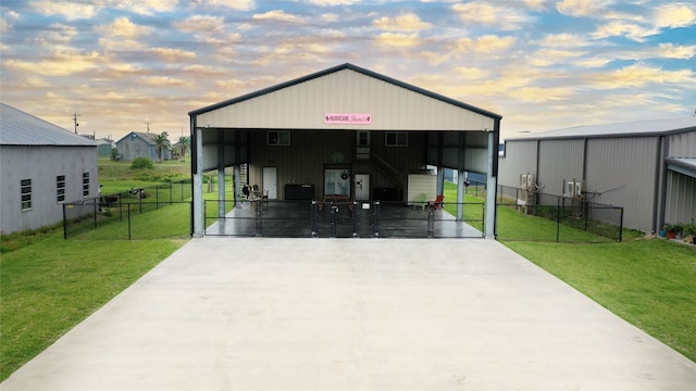 exterior space with a carport and a yard