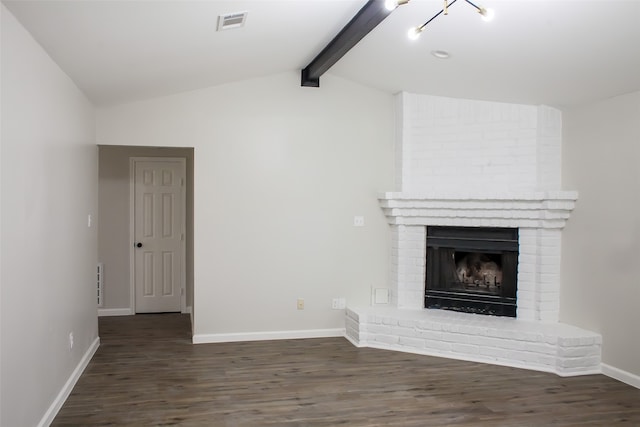 unfurnished living room with lofted ceiling with beams, brick wall, dark wood-type flooring, and a brick fireplace