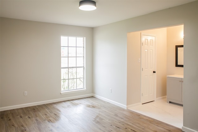 spare room featuring light hardwood / wood-style floors