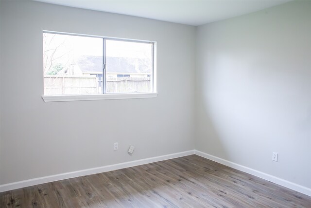 spare room with hardwood / wood-style floors