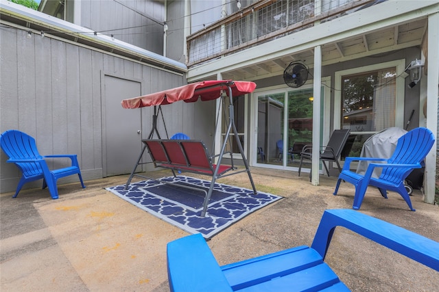 view of patio featuring a balcony