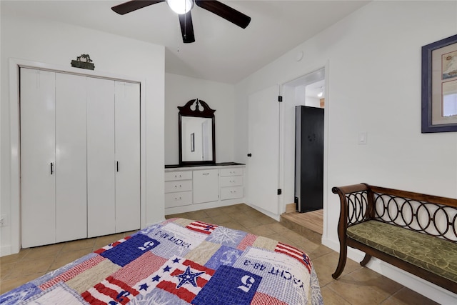 tiled bedroom featuring a closet and ceiling fan