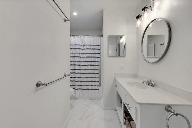 bathroom featuring vanity, a shower with shower curtain, and toilet