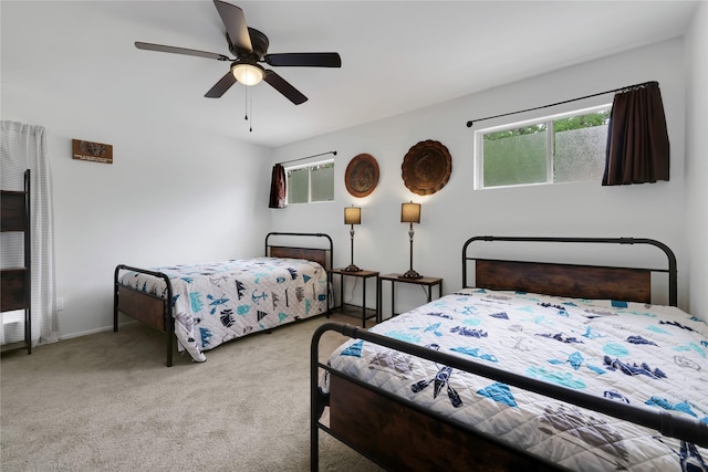 bedroom with light colored carpet and ceiling fan