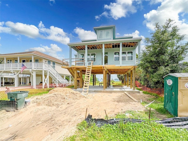 back of property featuring a porch