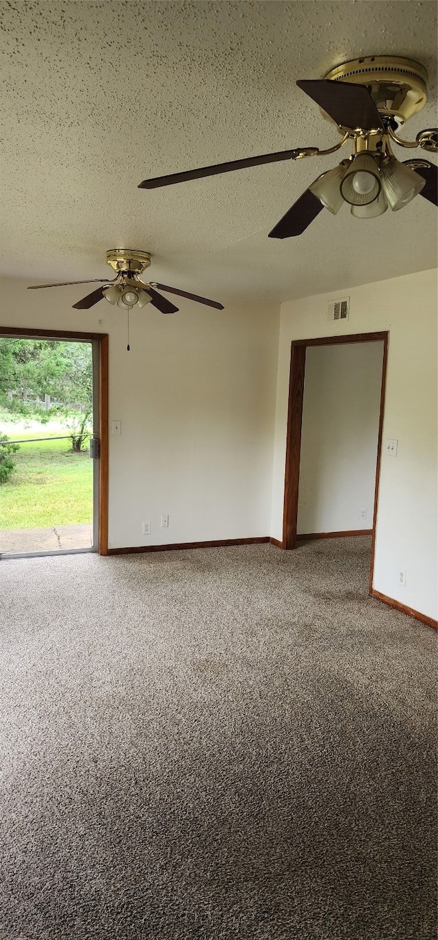 spare room featuring carpet, a textured ceiling, and ceiling fan