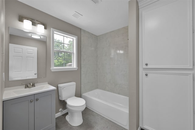 full bathroom with tile flooring, toilet, tiled shower / bath combo, and large vanity