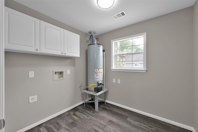 laundry room featuring hookup for a washing machine, gas water heater, cabinets, and dark wood-type flooring