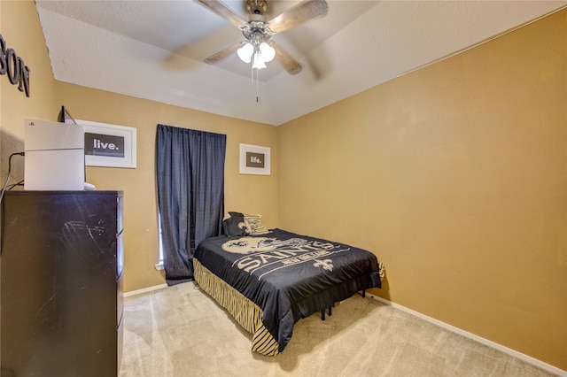 bedroom with ceiling fan and carpet floors