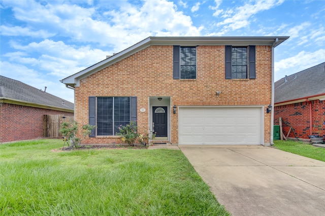 view of front of property with a front lawn and a garage