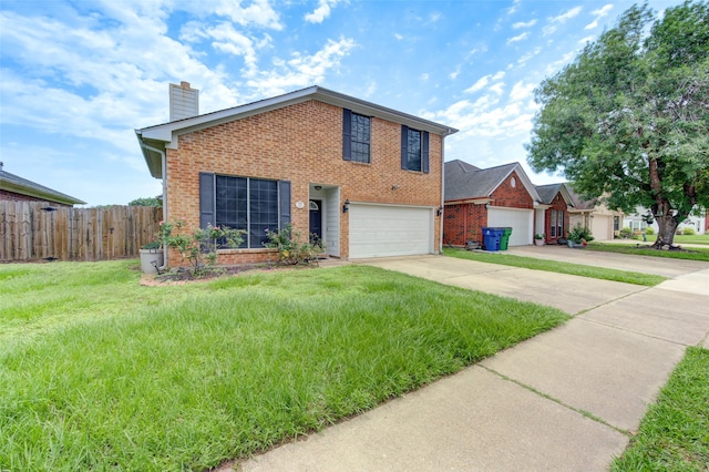 view of front of house with a garage and a front yard