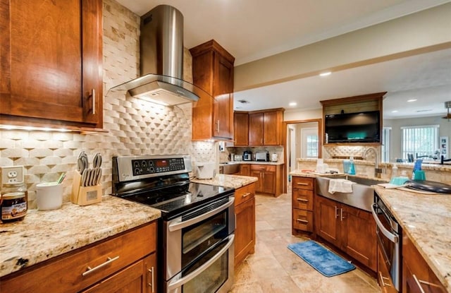 kitchen with light stone countertops, backsplash, double oven range, wall chimney range hood, and light tile floors