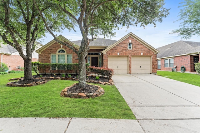 view of property featuring a front yard and a garage