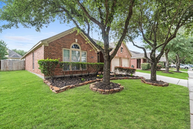 view of front of house featuring a front yard and a garage