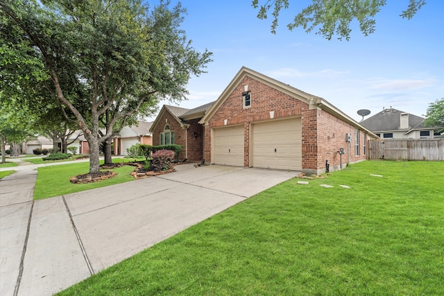 view of front of house featuring a garage and a front yard