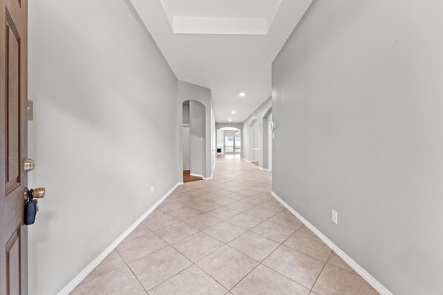 corridor with light tile floors