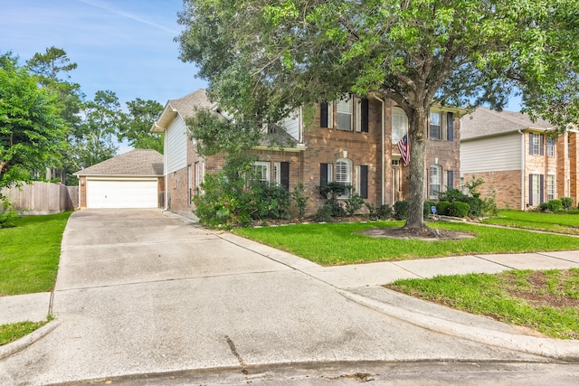 view of front of property with a garage and a front lawn