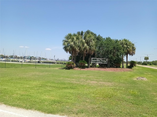 view of property's community with a yard