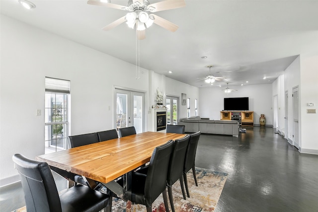 dining room with ceiling fan and french doors