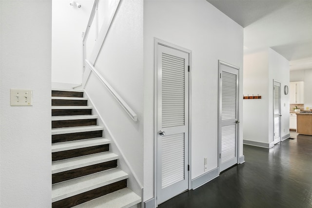 stairs with hardwood / wood-style flooring