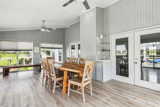 dining room with ceiling fan, ornamental molding, light hardwood / wood-style flooring, and french doors