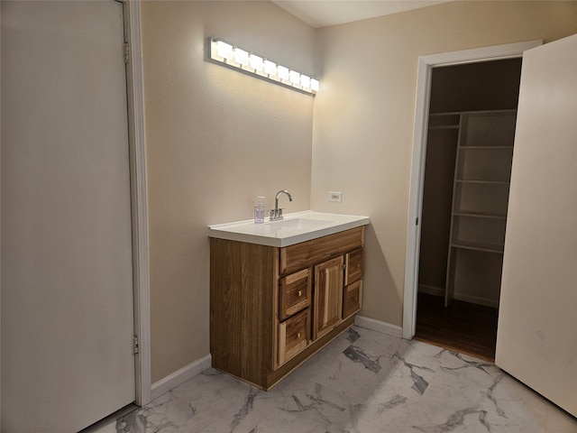 bathroom featuring tile floors and vanity