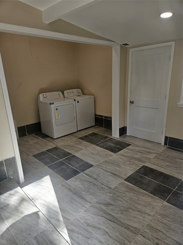 laundry area featuring tile flooring and separate washer and dryer