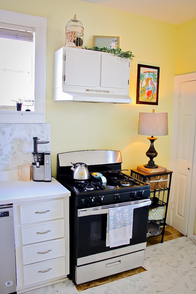 kitchen featuring dishwasher, white cabinetry, and gas stove