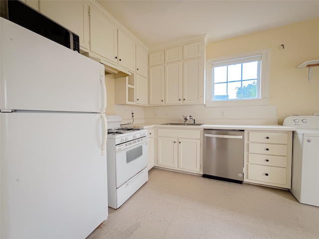 kitchen featuring white appliances, sink, washer / dryer, and light tile floors