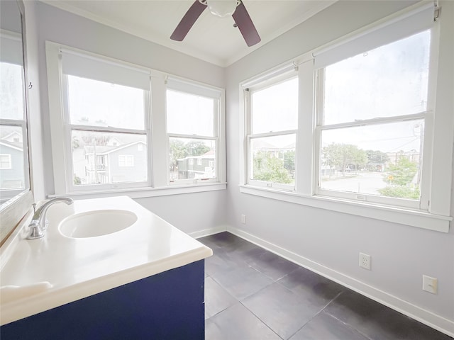 bathroom with ceiling fan, tile flooring, a healthy amount of sunlight, and vanity