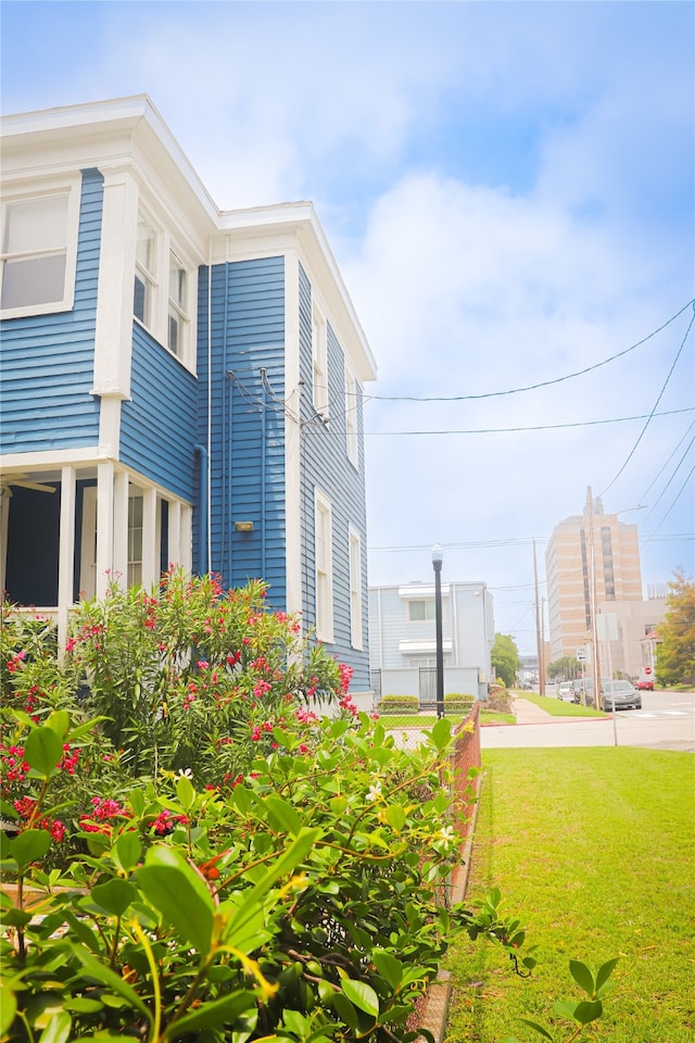 view of side of property with a yard