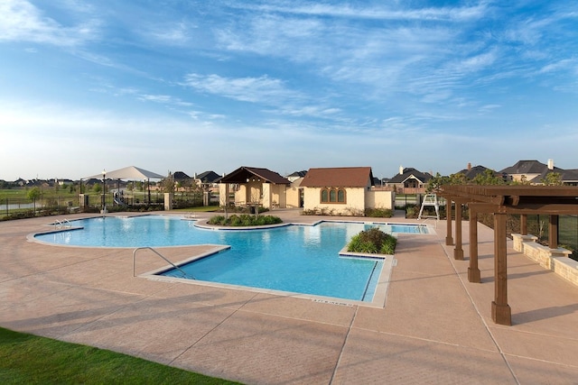 view of swimming pool featuring a patio area