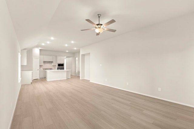 unfurnished living room with light wood-type flooring and ceiling fan