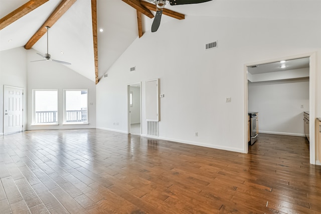 empty room with beamed ceiling, ceiling fan, dark wood-type flooring, and high vaulted ceiling