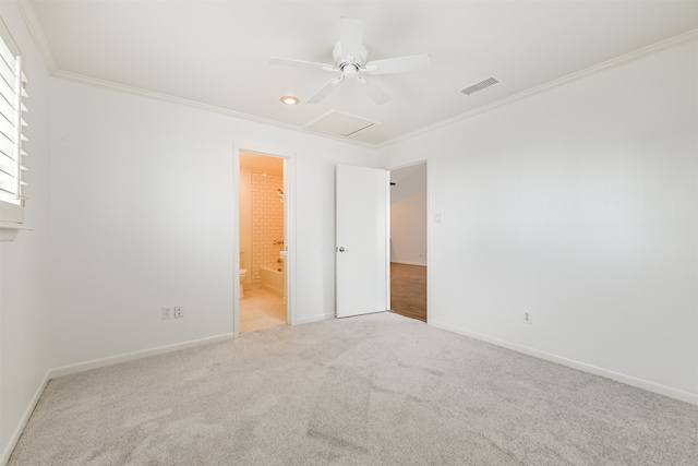 carpeted empty room with ceiling fan and crown molding