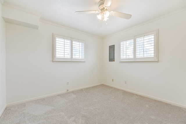 empty room with electric panel, light colored carpet, and a healthy amount of sunlight