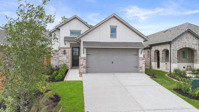 view of front of property with a garage and a front yard