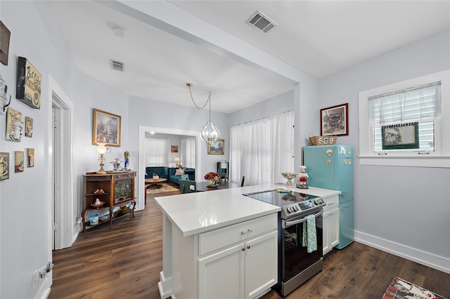 kitchen featuring stainless steel electric stove, dark hardwood / wood-style floors, white cabinets, hanging light fixtures, and kitchen peninsula