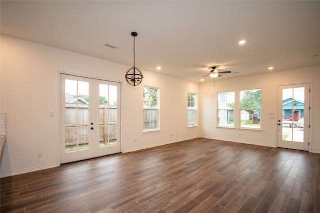 interior space featuring a healthy amount of sunlight, french doors, and dark hardwood / wood-style flooring