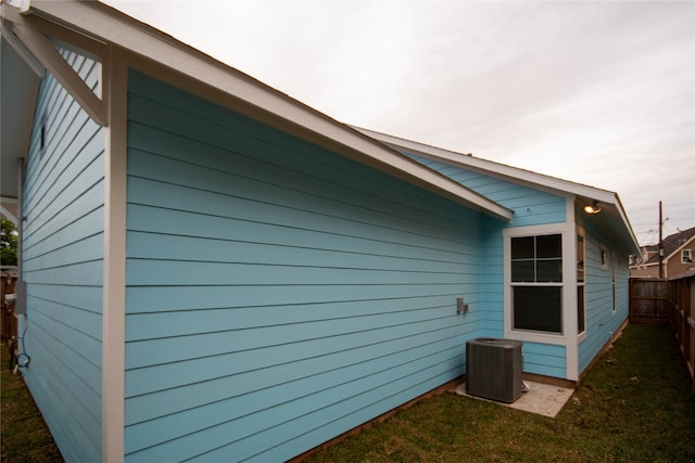 view of property exterior with central AC