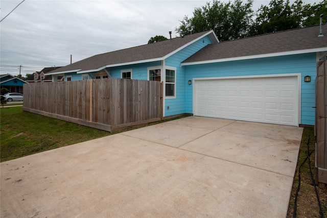 ranch-style house featuring a garage