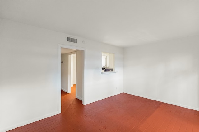 empty room featuring dark hardwood / wood-style floors