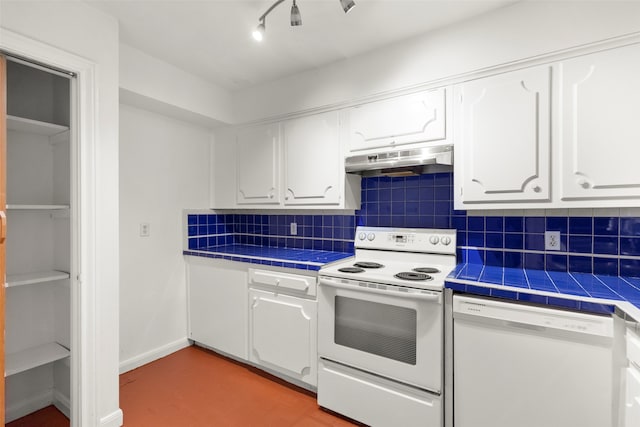 kitchen with backsplash, white cabinetry, tile countertops, and white appliances