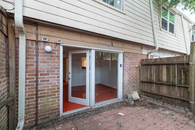 doorway to property featuring a patio area