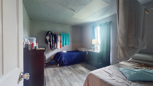 bedroom with light hardwood / wood-style flooring