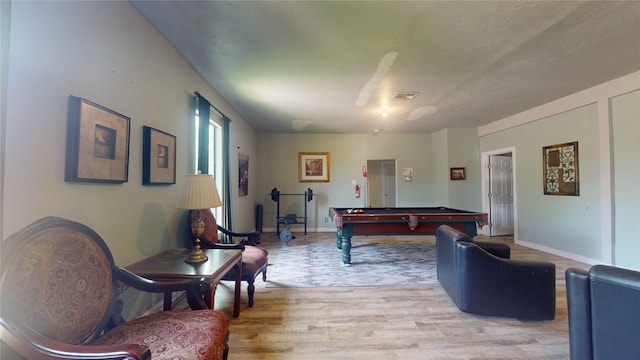 game room featuring light hardwood / wood-style floors and billiards