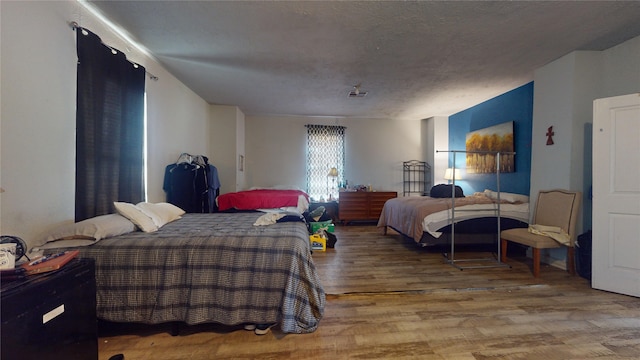 bedroom featuring wood-type flooring