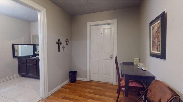 corridor with light wood-type flooring