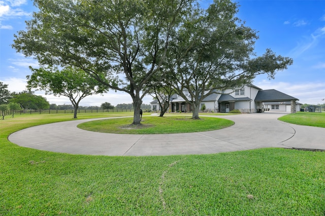 exterior space featuring a garage and a front yard