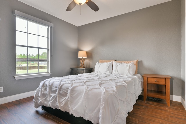 bedroom with dark wood-type flooring and ceiling fan